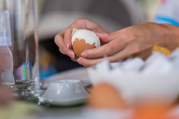 women is peeleng Egg stock photo