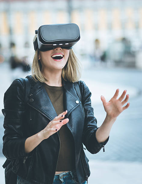 women testing virtual reality simulator on the street - virtual reality headset bildbanksfoton och bilder