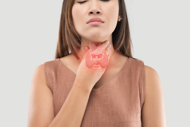 Women thyroid gland control. Sore throat of a people on gray background stock photo