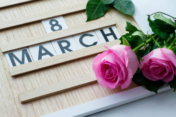 Women's Day is March 8 with a calendar board and fresh flowers. Calendar with the date March 8 - the Festival of colors stock photo