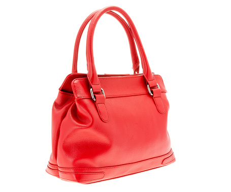 Ladies red handbag.    Isolated against a white background.