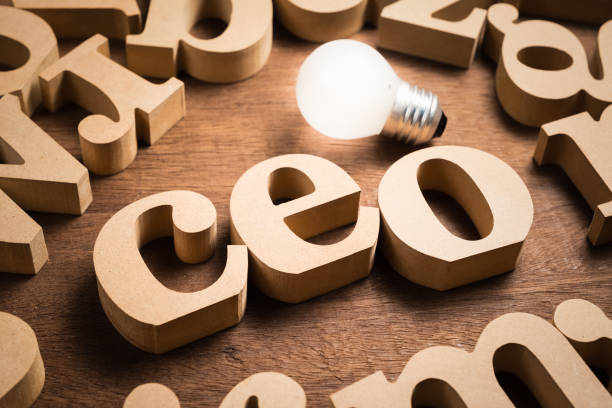 CEO wood alphabets CEO (Chief Executive Officer) wood letters in scattered alphabets with glowing light bulb ceo stock pictures, royalty-free photos & images