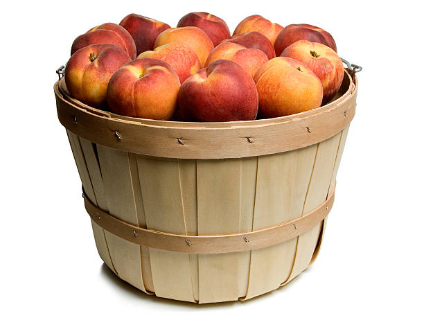 Wood basket with peaches stock photo