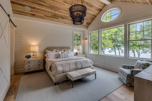 Wood cathedral style ceiling in bedroom stock photo