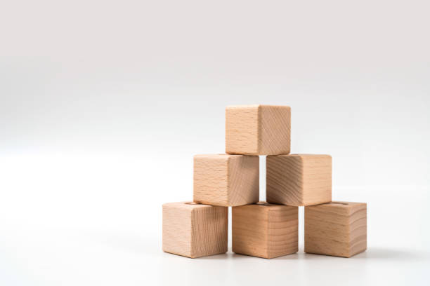 wood cube arrange in pyramid shape ,business concept wood cube arrange in pyramid shape ,business concept asien startblock stock pictures, royalty-free photos & images