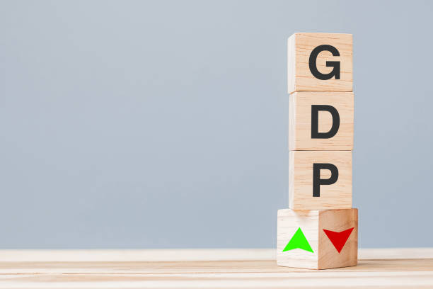 wood cube block with GDP text (Gross domestic product) to UP and Down arrow symbol icon. Financial, Management, Economic and business concepts stock photo