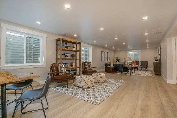 Wood flooring in basement rec room area with a lot of space Areas for relaxing, studying, reading, and simply hanging out with family and friends basement photos stock pictures, royalty-free photos & images
