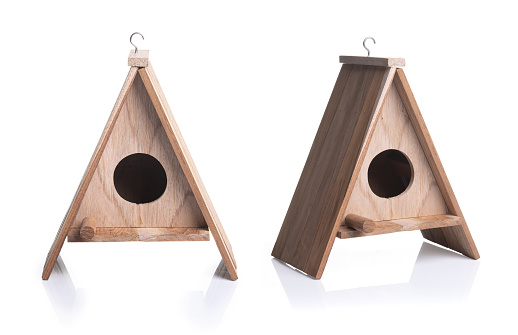 Wooden bird house isolated on a white background