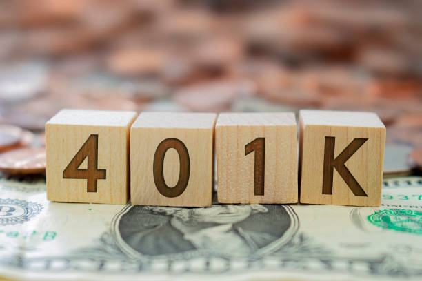 Wooden block with the number 401K with some money around. Concept: Retirement Plan in USA Wooden block with the number 401K with some money around. Concept: Retirement Plan in USA 401k stock pictures, royalty-free photos & images