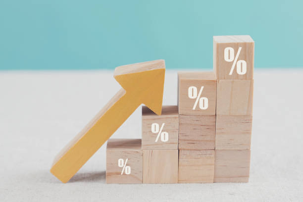 Wooden blocks with percentage sign and arrow up, financial growth, interest rate increase, inflation concept Wooden blocks with percentage sign and arrow up, financial growth, interest rate increase, inflation concept exchange rate stock pictures, royalty-free photos & images