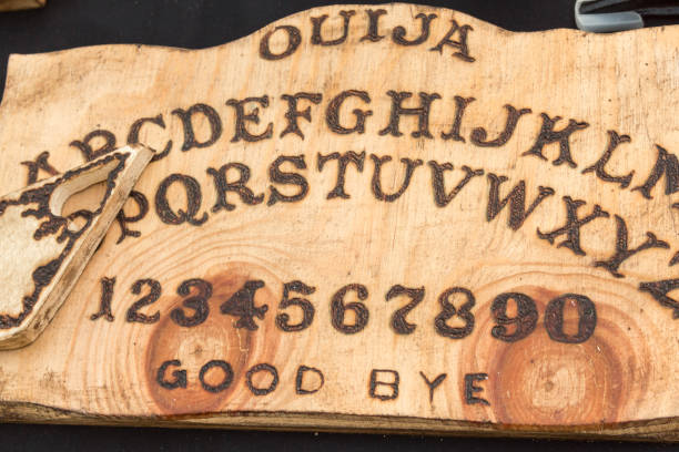 Wooden Board Ouija: Communication with Spirits Wooden Board Ouija: Communication with Spirits- ouija board stock pictures, royalty-free photos & images