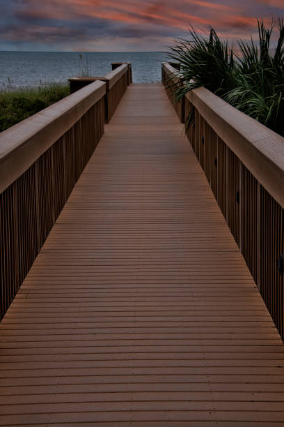 Wooden Boardwalk Extending out to Amelia Island Beach, Florida stock photo