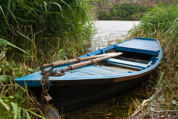 Wooden boat with oars stock photo