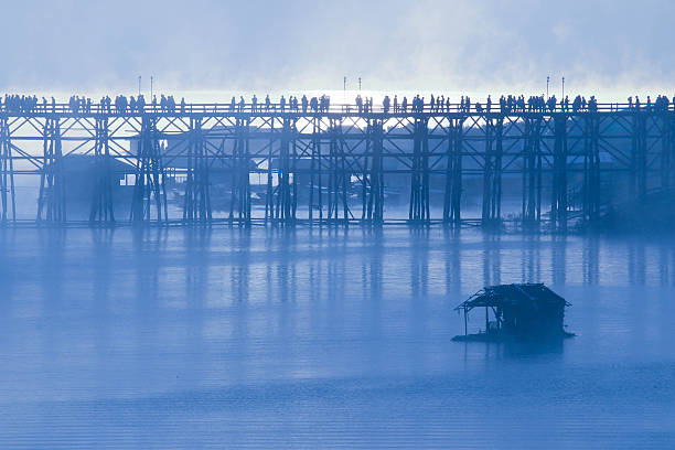 Wooden bridge of Sangklaburi in Kanjanaburi province,Thailand, Morning day. stock photo
