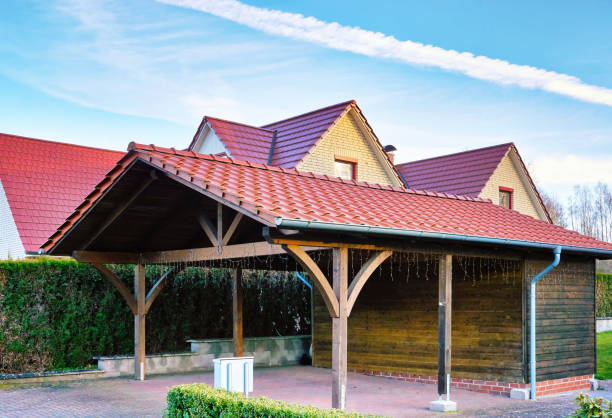 Wooden carport with red brick roof on a new house. Wooden carport with red brick roof on a new house. shed stock pictures, royalty-free photos & images
