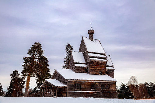 View of old wooden church of St. George the Victorious (1522) on gloomy February morning. Rodionovo (Yuksovichi). Leningrad region, Russia