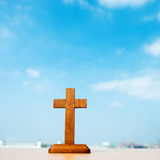 Wooden cross and blue sky  good friday stock pictures, royalty-free photos & images