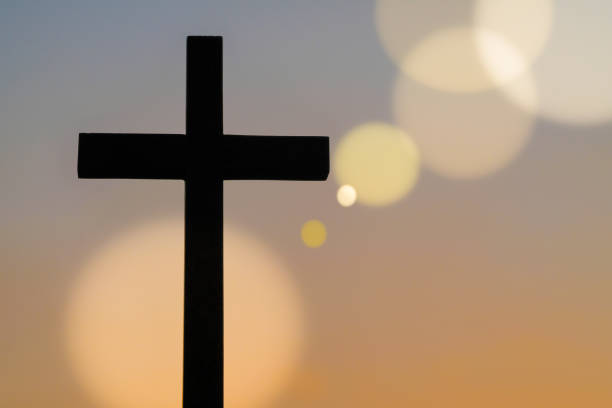 Wooden cross standing. Silhouette, Religion cross, sky background, bokeh light christian democratic union stock pictures, royalty-free photos & images