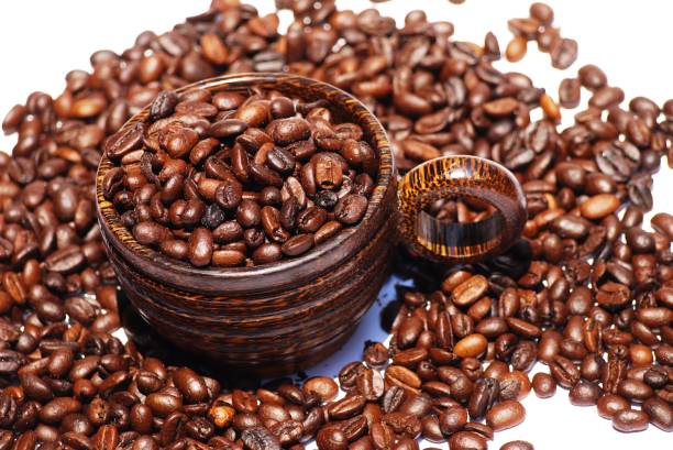Wooden  cup and coffee  bean on  isolate white background  , selective focus . stock photo