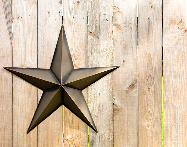 Wooden fence with metal Texas star. Wooden fence with Texas star rusty fence stock pictures, royalty-free photos & images