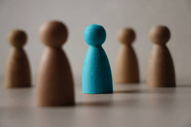 Wooden figures on a table stock photo