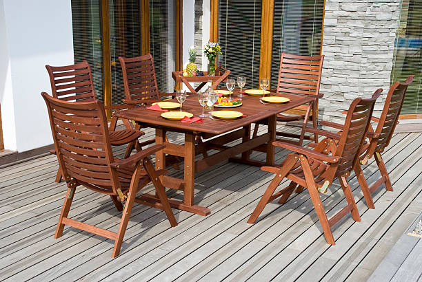 Wooden garden furniture on a sun deck stock photo