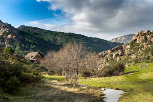 Wooden house in La Pedriza, Guadarrama Mountains National Park Wooden house in La Pedriza, Guadarrama Mountains National Park, province of Madrid, Spain granitic stock pictures, royalty-free photos & images