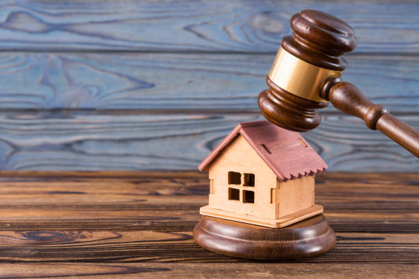 wooden house, judge's gavel on wooden background stock photo