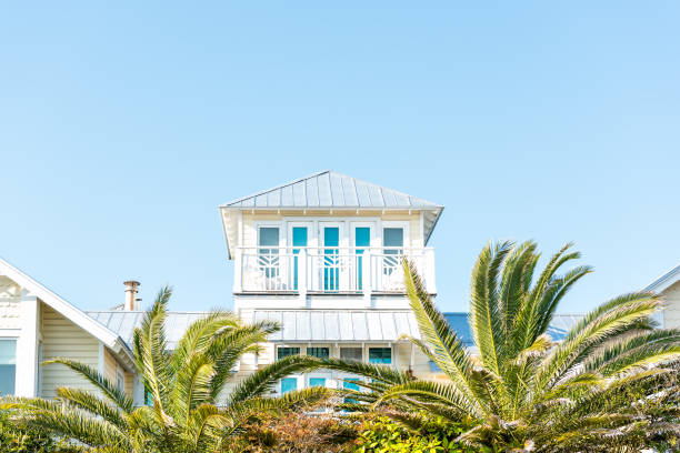 Wooden house tower new urbanism modern architecture by beach ocean, nobody in Florida view during sunny day Wooden house tower new urbanism modern architecture by beach ocean, nobody in Florida view during sunny day coastline stock pictures, royalty-free photos & images