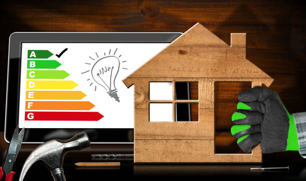 Wooden Model House with Energy Efficiency Rating stock photo