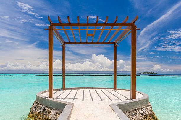 Wooden pavilion at Maldives in front of Indian ocean stock photo