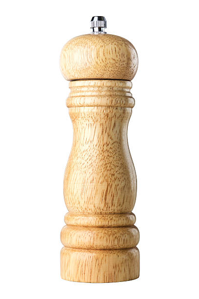 wooden pepper mill on white background stock photo