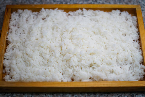 A wooden plate of rice stock photo