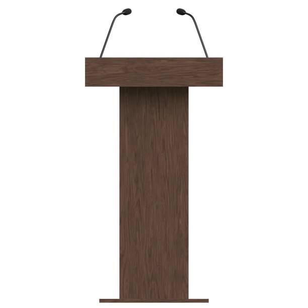 Wooden podium with two microphones stock photo