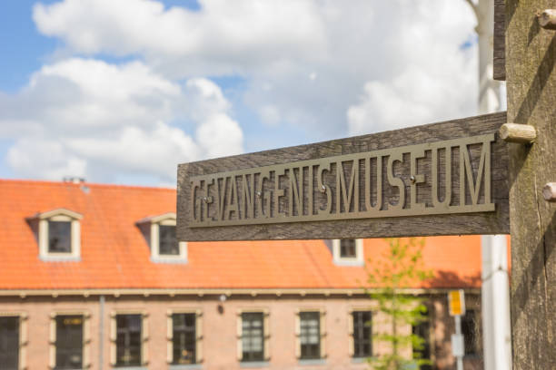 Wooden sign with the dutch word for prison museum in Veenhuizen stock photo