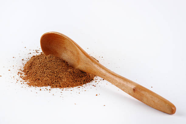Wooden spoon in cinnamon stock photo