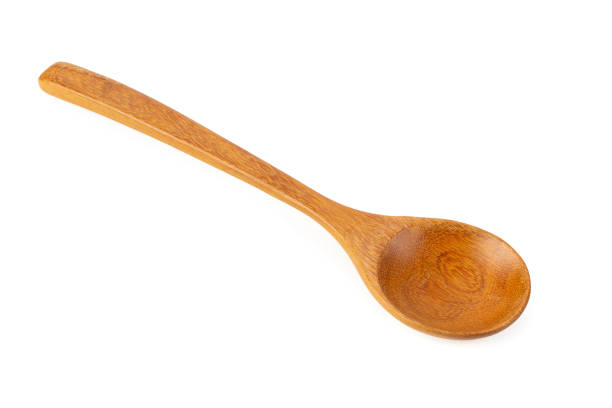 Wooden spoon isolated on a white background stock photo