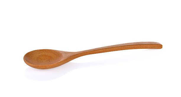 wooden spoon isolated on white background stock photo