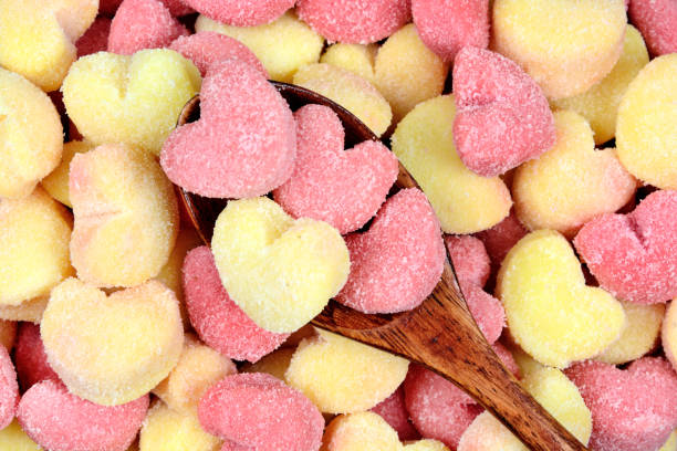 Wooden spoon on a many gnocchi hearts stock photo