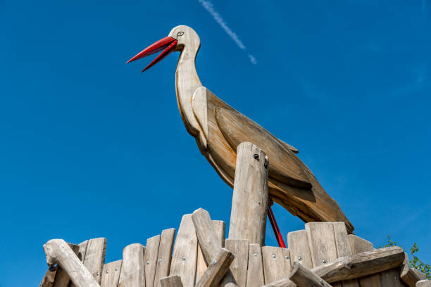 Wooden stork on climbing frame on playground stock photo