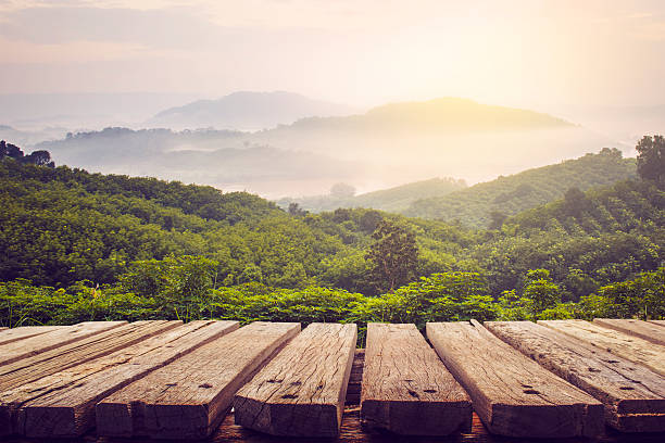 Photo of wooden table and view of mountain