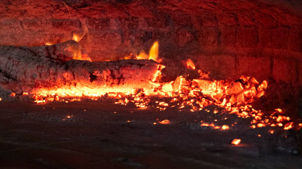 Woods Burning with Red and Orange Hues, Fire, Embers and Hot Stove, Traditional Baking Oven stock photo