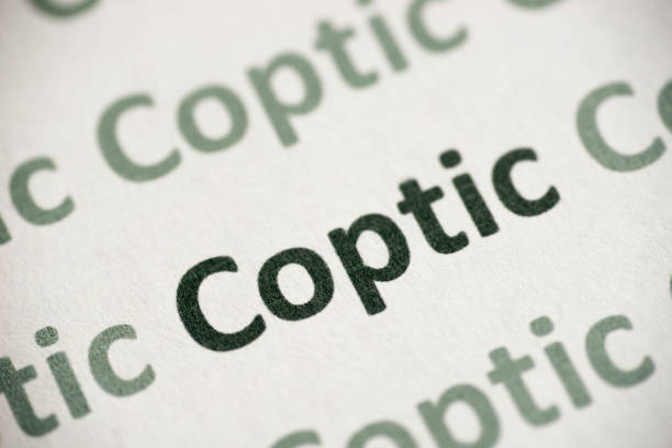 word Coptic language printed on paper macro word Coptic language printed on white paper macro coptic stock pictures, royalty-free photos & images