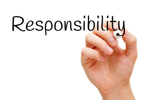 Word Responsibility Handwritten With Black Marker Hand writing the word Responsibility with black marker on transparent wipe board isolated on white. responsibility stock pictures, royalty-free photos & images