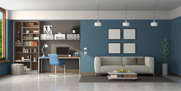Work at home in a large living room with brown and blue walls Work at home in a large living room with desk,office chair,bookcase and modern sofa - 3d rendering
Note: the room does not exist in reality, Property model is not necessary studio workplace photos stock pictures, royalty-free photos & images