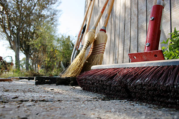 Work, Construction, Clean Up tools outside leaning on a Barn stock photo
