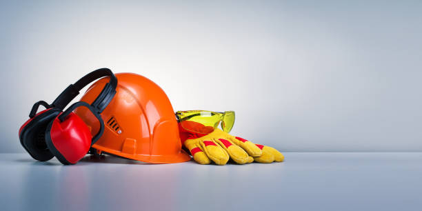 Work safety protection equipment on grey background with copy space. Horizontal banner. stock photo