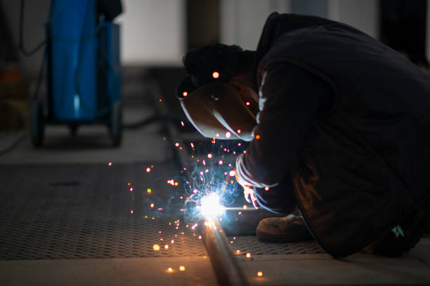 A worker is doing gas welding stock photo