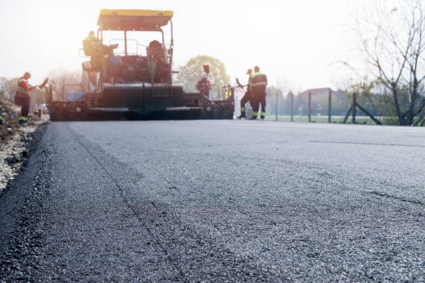 Workers placing new coating of asphalt on the road. Road construction. Road construction. road construction stock pictures, royalty-free photos & images