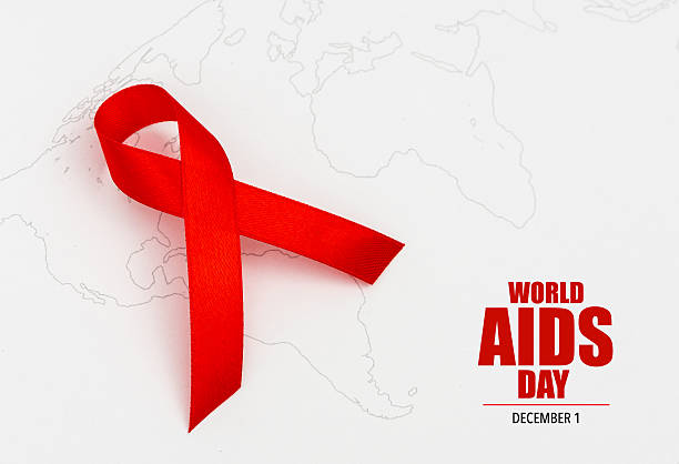 World AIDS Day on world map stock photo